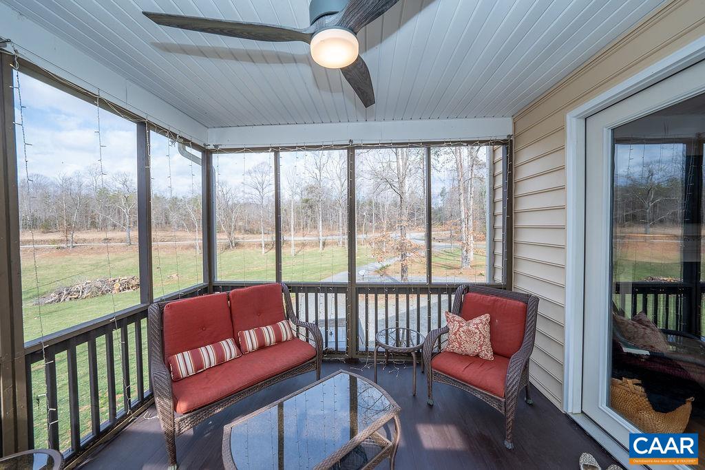60 Pine Ridge Road Faber, VA 22938 - Photo 25 of 74 a living room with furniture and a floor to ceiling window