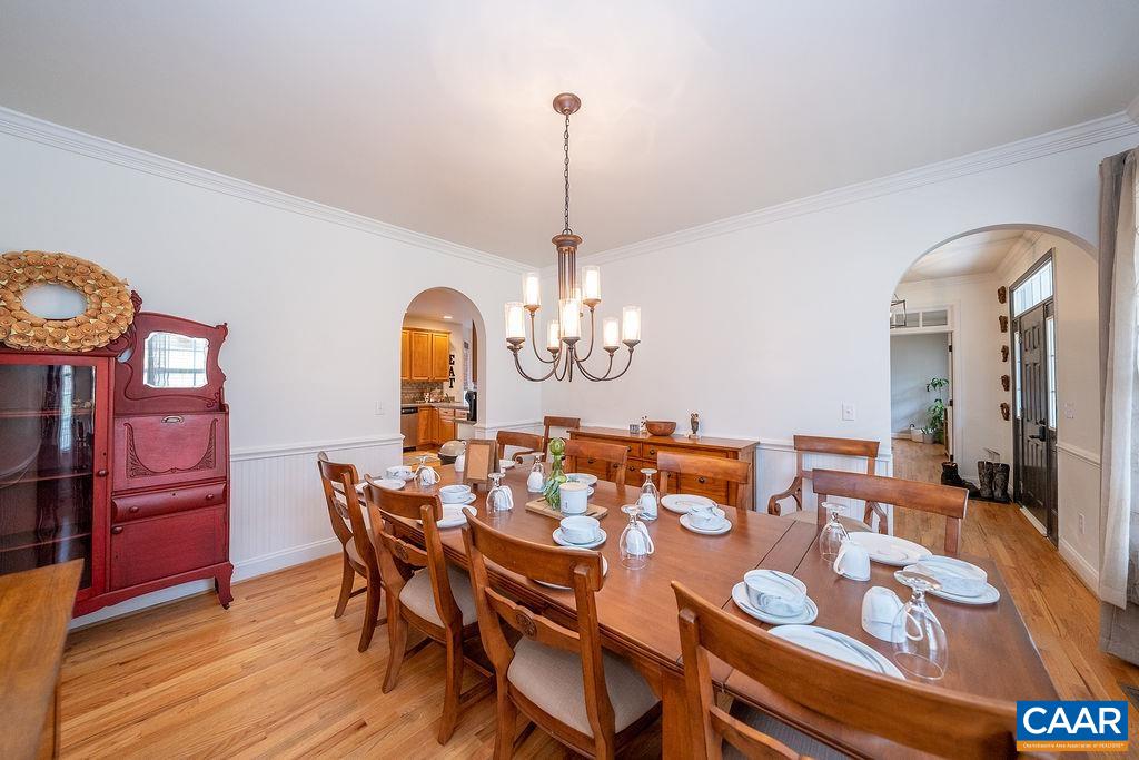 60 Pine Ridge Road Faber, VA 22938 - Photo 39 of 74 a dining room with furniture a chandelier and wooden floor