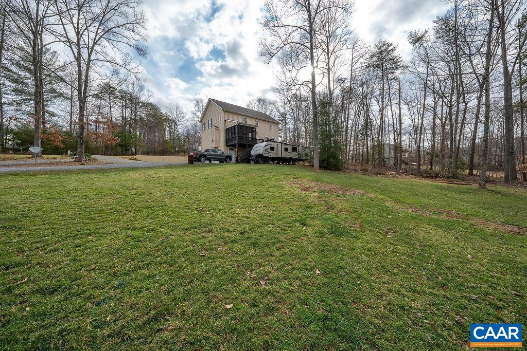 60 Pine Ridge Road Faber, VA 22938 - Photo 60 of 74 a front view of a house with a garden and trees