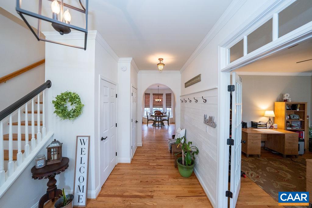 60 Pine Ridge Road Faber, VA 22938 - Photo 6 of 74 a hallway with a dining table wooden floor and a dining table