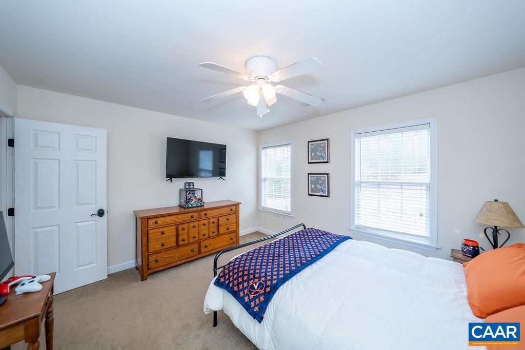 60 Pine Ridge Road Faber, VA 22938 - Photo 61 of 74 a bedroom with a bed and a flat screen tv