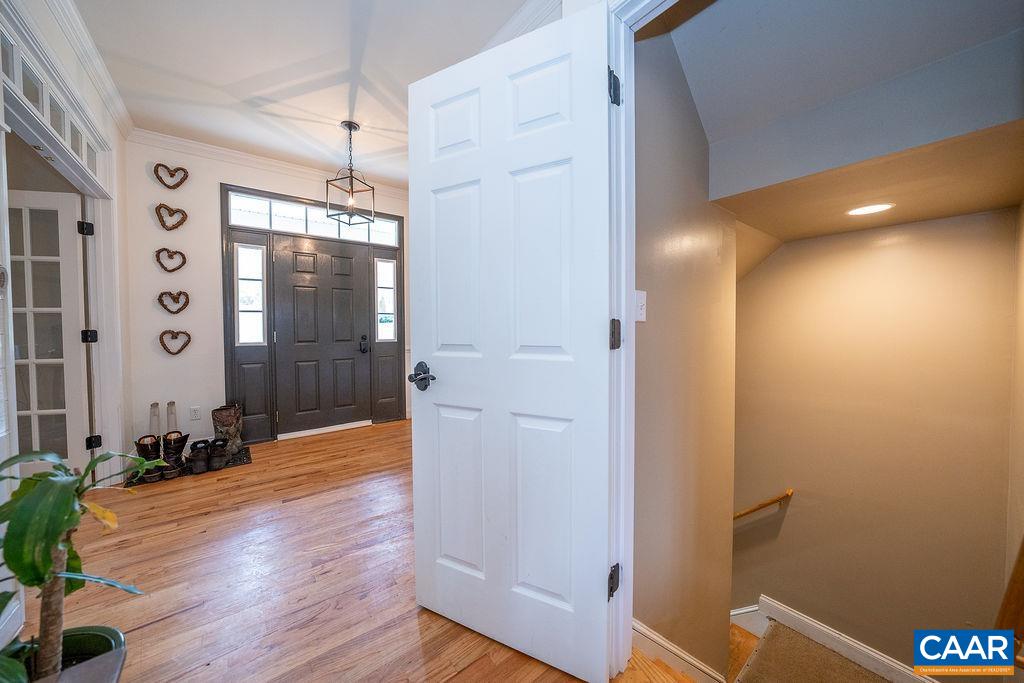 60 Pine Ridge Road Faber, VA 22938 - Photo 63 of 74 a view of a hallway with wooden floor and a bathroom