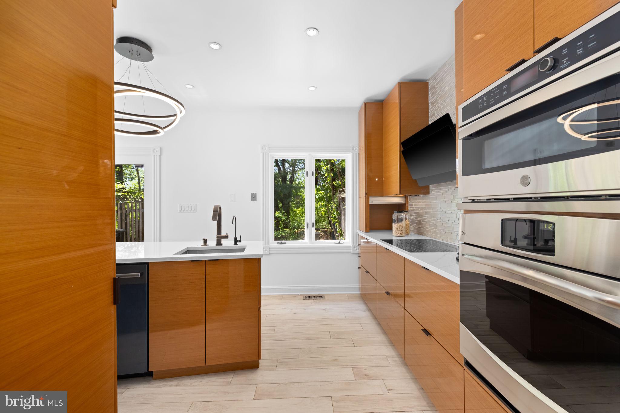 4018 Chancery Court Northwest Washington, DC 20007 - Photo 12 of 43 a white kitchen with a stove top oven
