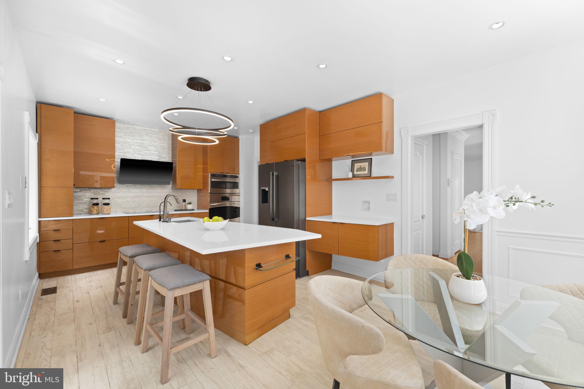 4018 Chancery Court Northwest Washington, DC 20007 - Photo 17 of 43 a kitchen that has a table and chairs in it