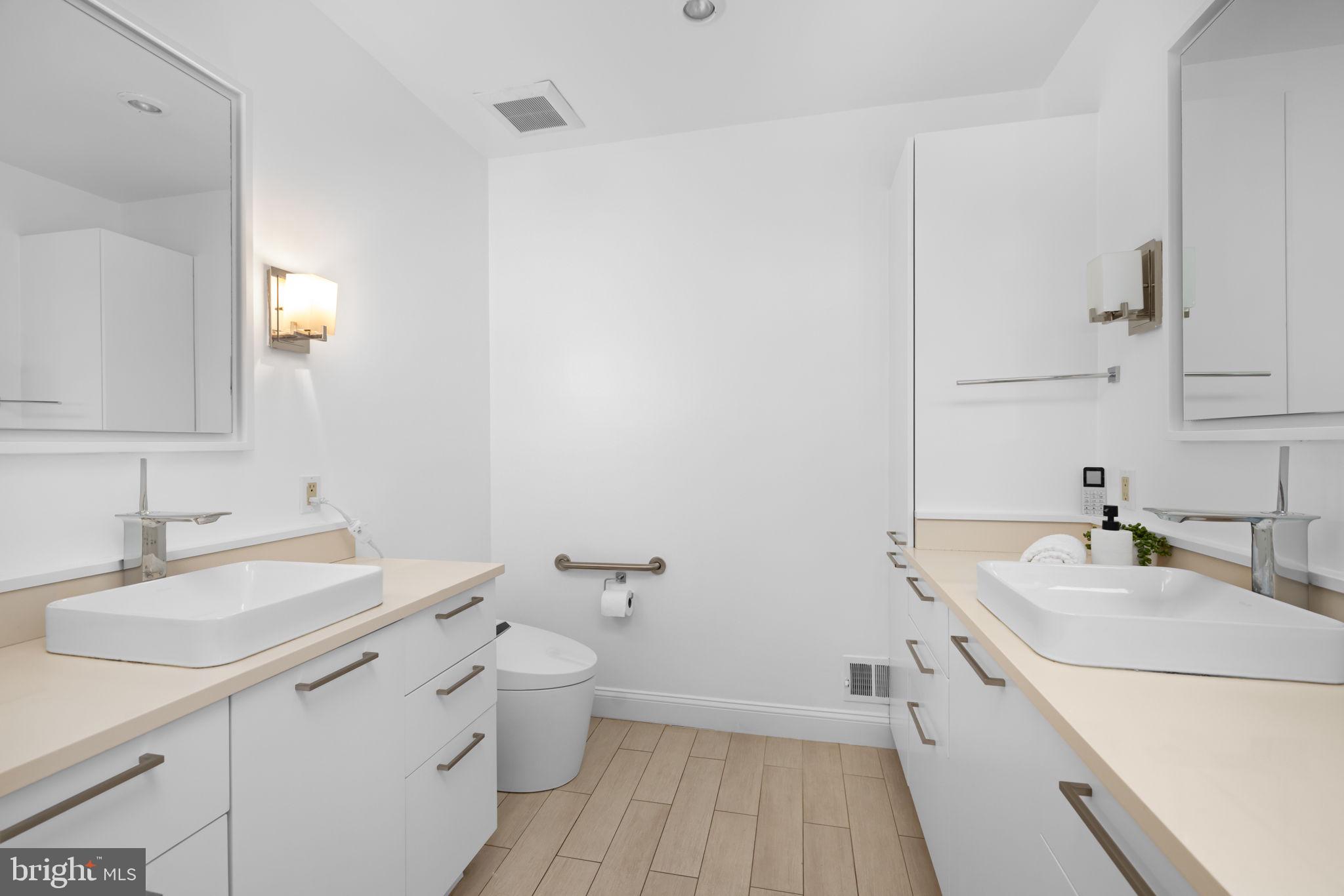 4018 Chancery Court Northwest Washington, DC 20007 - Photo 26 of 43 a bathroom with a sink a toilet and a mirror