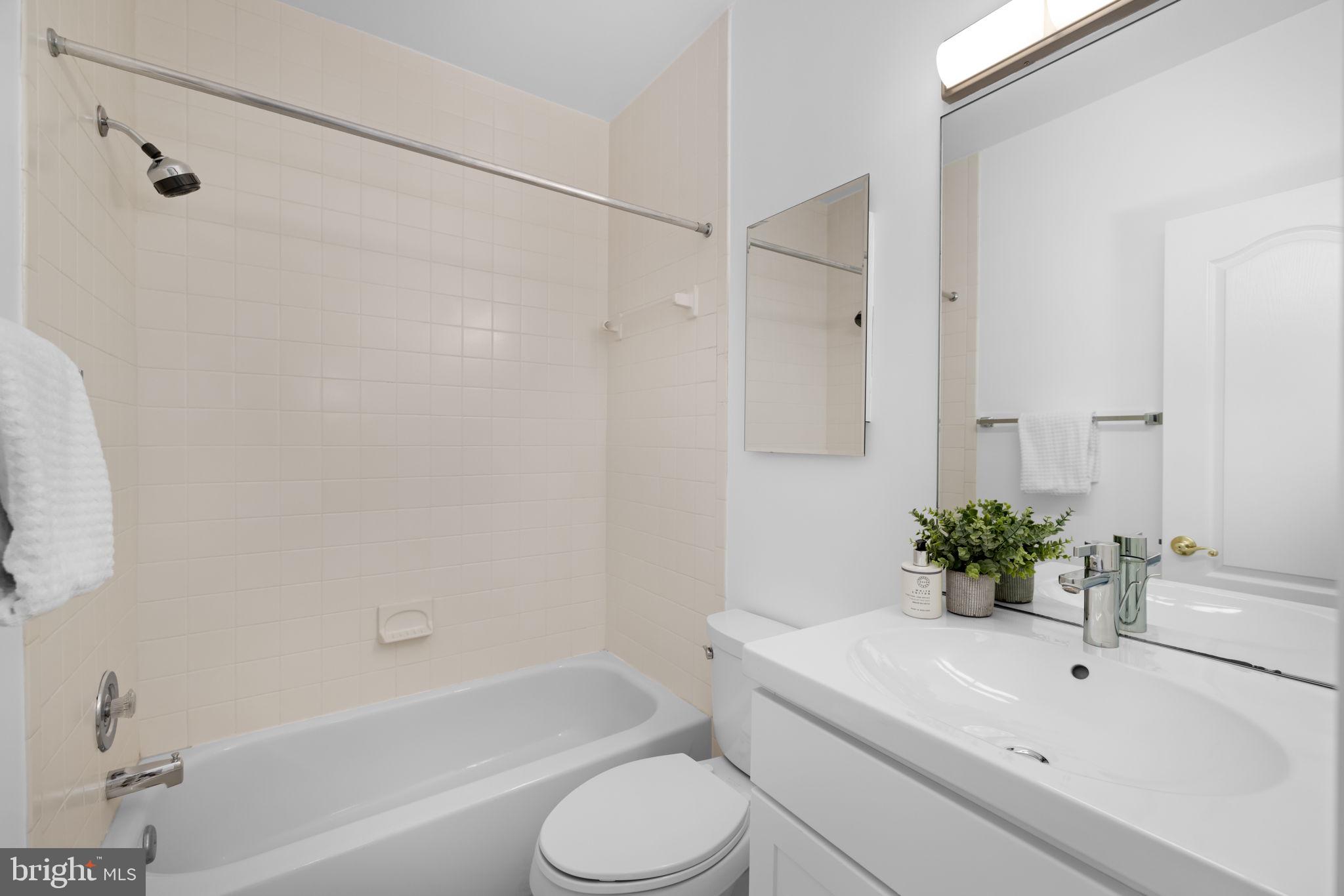 4018 Chancery Court Northwest Washington, DC 20007 - Photo 33 of 43 a bathroom with a sink toilet and shower