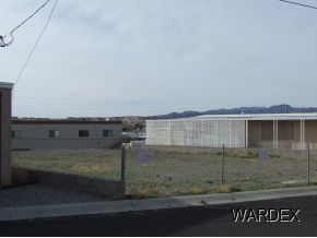 10106 Harbor View Road Parker, AZ 85344 - Photo 4 of 7 a view of a dry yard with wooden fence