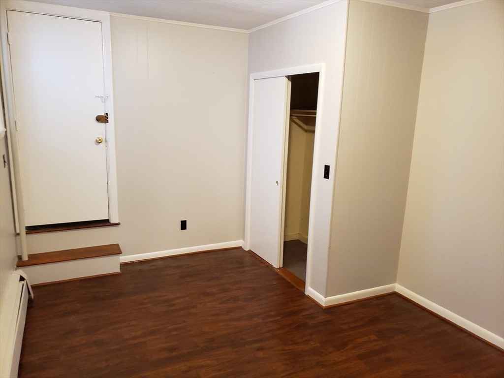 18 Central Avenue, Unit 1 Chelsea, MA 02150 - Photo 5 of 6 an empty room with wooden floor