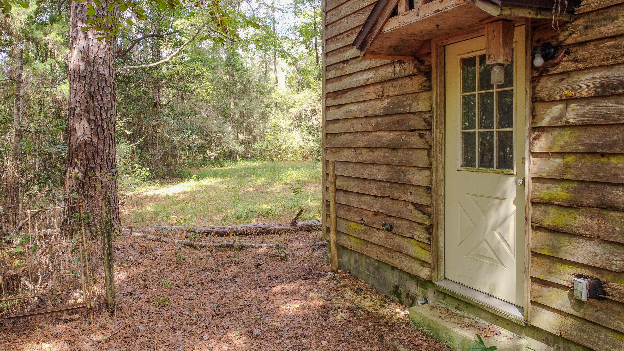 402 Miles Martin Road DeFuniak Springs, FL 32435 - Photo 17 of 31 a view of a house with a tree