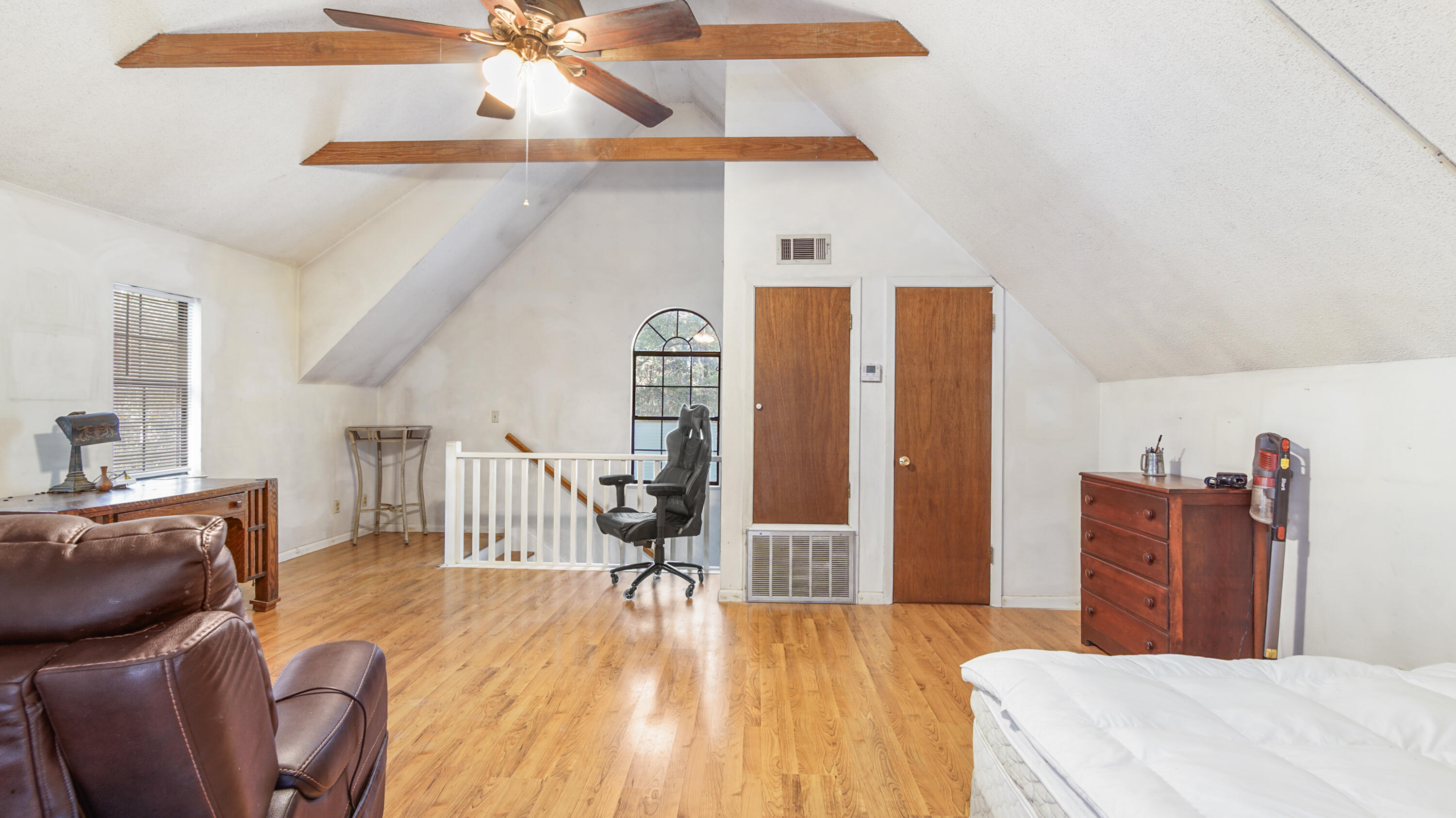 402 Miles Martin Road DeFuniak Springs, FL 32435 - Photo 6 of 31 a bedroom with furniture and wooden floor