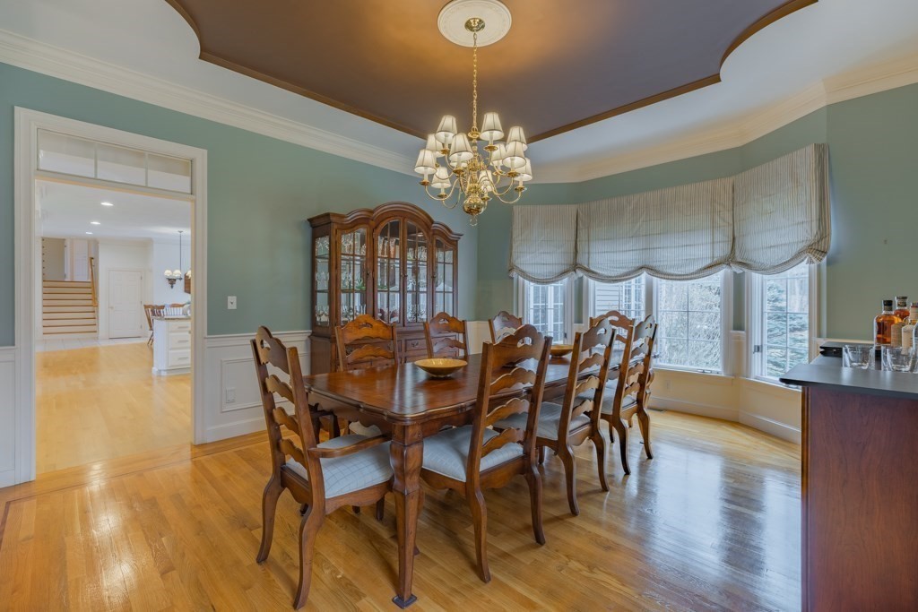 4 Walker Lane Boxford, MA 01921 - Photo 11 of 40 a view of a dining room with furniture and wooden floor