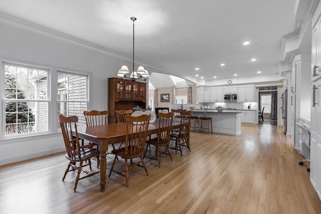 4 Walker Lane Boxford, MA 01921 - Photo 13 of 40 a view of a dining room and livingroom with furniture wooden floor a chandelier