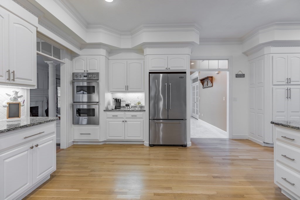 4 Walker Lane Boxford, MA 01921 - Photo 15 of 40 a kitchen with stainless steel appliances a refrigerator and a stove top oven