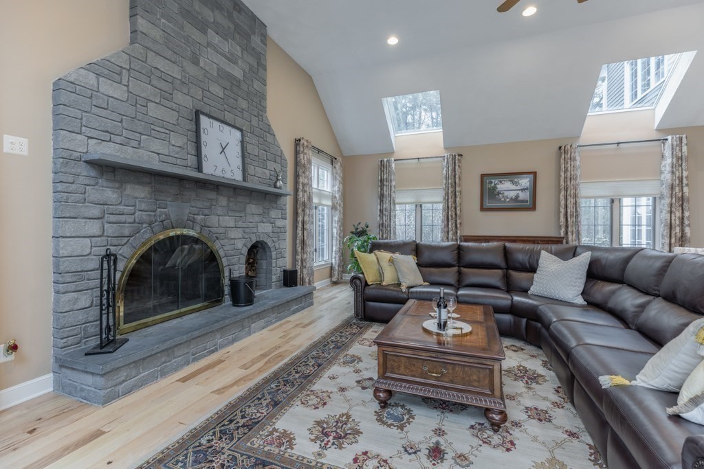 4 Walker Lane Boxford, MA 01921 - Photo 20 of 40 a living room with furniture and a fireplace