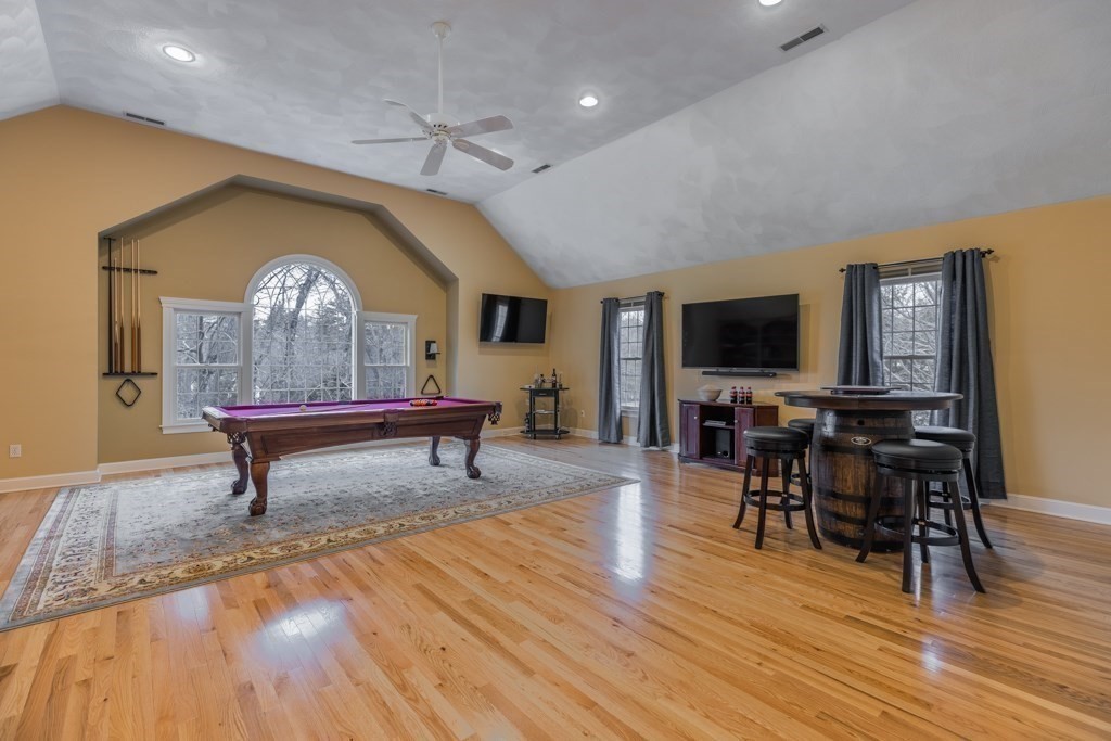 4 Walker Lane Boxford, MA 01921 - Photo 23 of 40 a living room with furniture a window and a flat screen tv