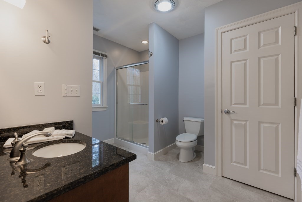 4 Walker Lane Boxford, MA 01921 - Photo 26 of 40 a bathroom with a granite countertop sink and a mirror