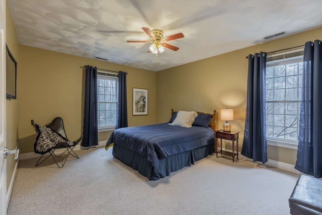 4 Walker Lane Boxford, MA 01921 - Photo 27 of 40 a bedroom with a bed and window