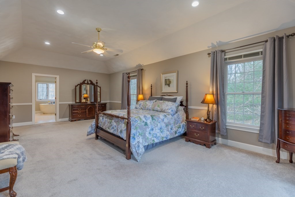 4 Walker Lane Boxford, MA 01921 - Photo 34 of 40 a bedroom with a bed and a lamp with window