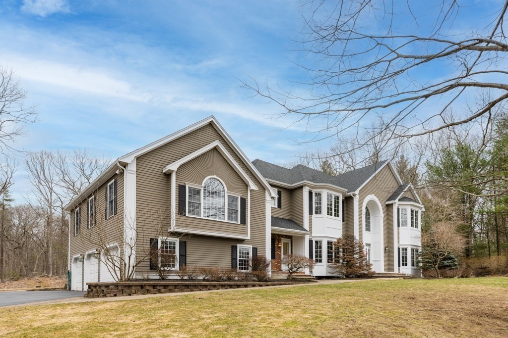 4 Walker Lane Boxford, MA 01921 - Photo 39 of 40 a front view of a house with a lot of windows and a tree