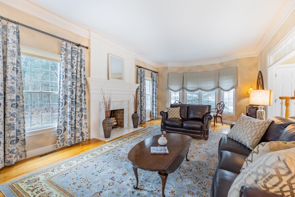 4 Walker Lane Boxford, MA 01921 - Photo 7 of 40 a living room with furniture and a fireplace