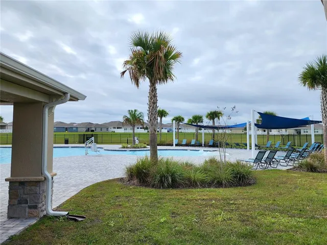 a view of chairs and tables in the patio