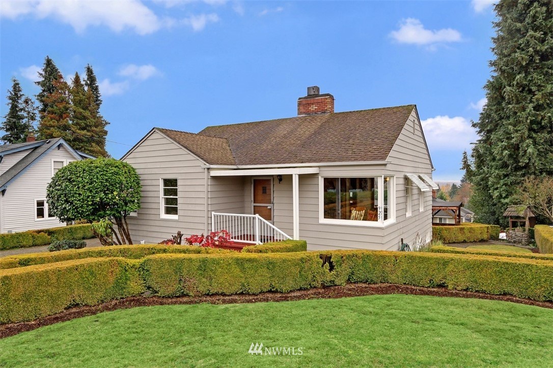 925 Southwest Langston Road Renton, WA 98057 - Photo 3 of 23 a front view of a house with a yard