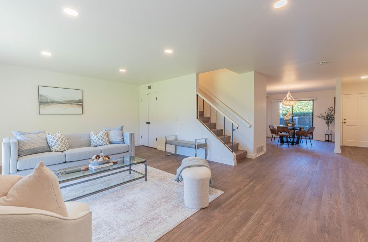 3850 Rio Road, Unit 24 Carmel, CA 93923 - Photo 11 of 39 a living room with furniture and a wooden floor