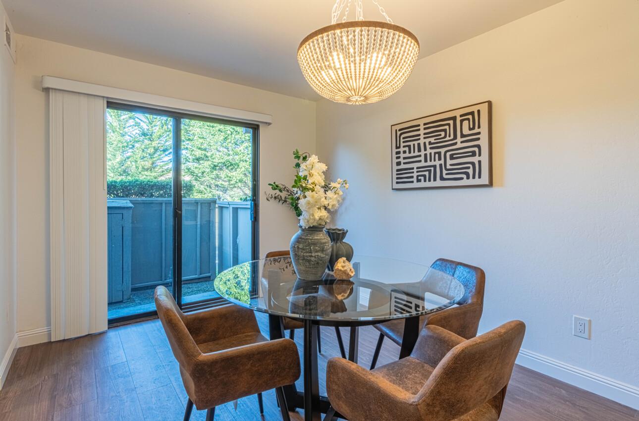 3850 Rio Road, Unit 24 Carmel, CA 93923 - Photo 12 of 39 a view of a dining room with furniture window and wooden floor