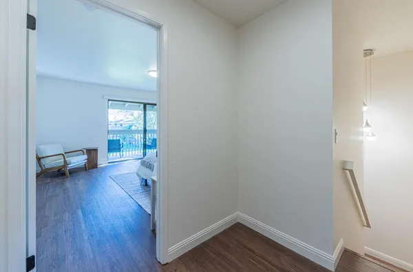 a bedroom with a bed and a chair