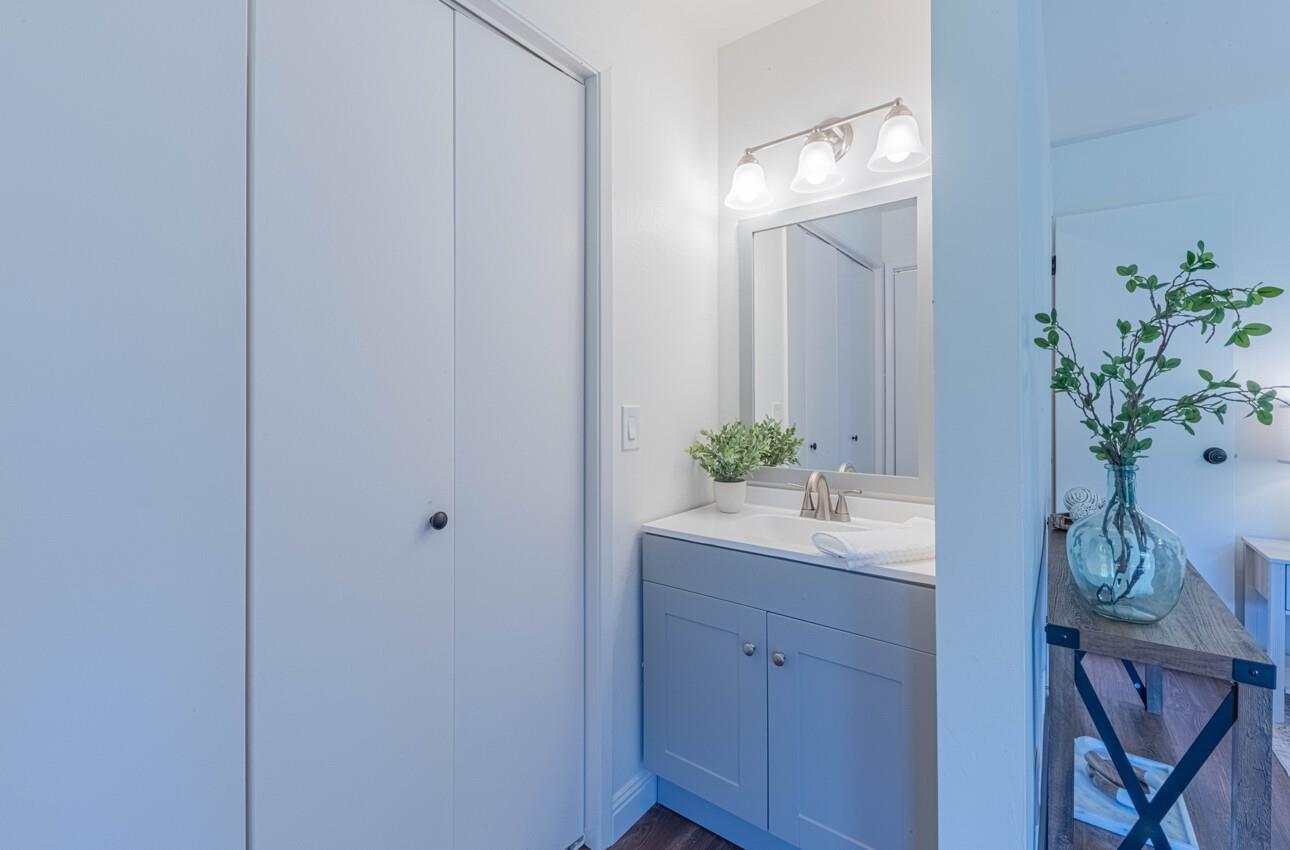 3850 Rio Road, Unit 24 Carmel, CA 93923 - Photo 28 of 39 a view of bathroom with a potted plant on the counter and mirror