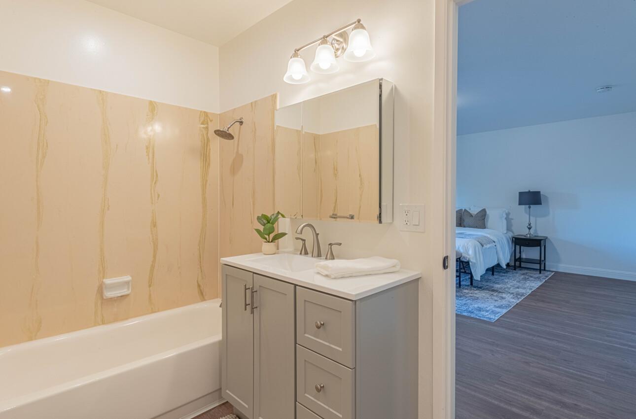 3850 Rio Road, Unit 24 Carmel, CA 93923 - Photo 34 of 39 a bathroom with a sink a mirror and a bathtub