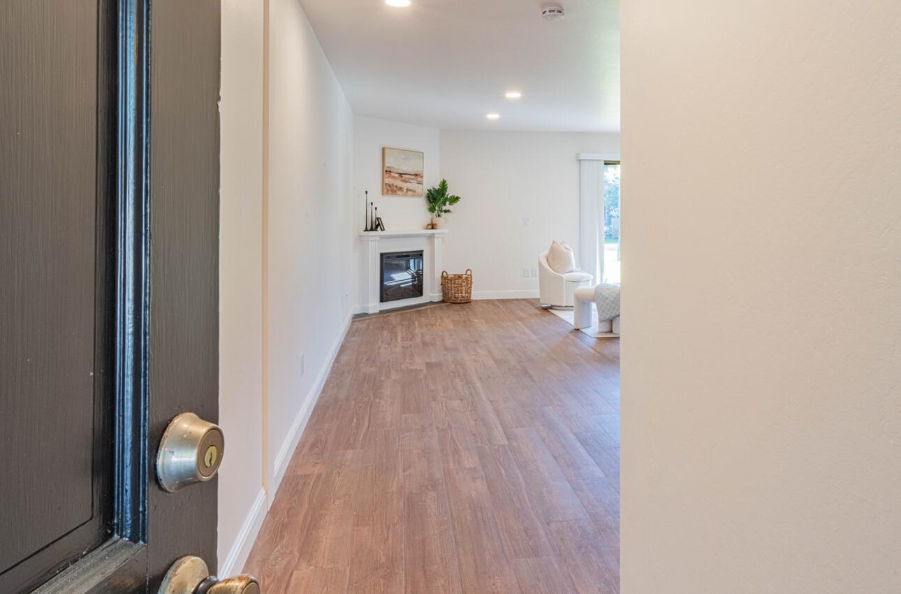 3850 Rio Road, Unit 24 Carmel, CA 93923 - Photo 6 of 39 a view of livingroom with furniture and wooden floor