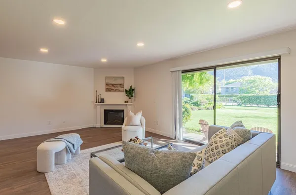 a living room with furniture and a fireplace