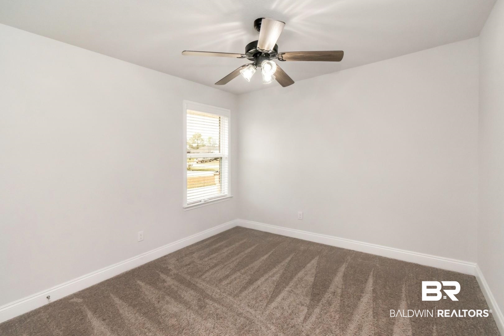 6632 Monarch Circle Mobile, AL 36618 - Photo 23 of 32 Unfurnished room featuring dark colored carpet and ceiling fan