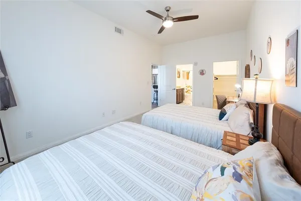 a bedroom with double bed and a window