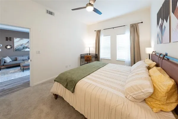 a bedroom with a bed and window