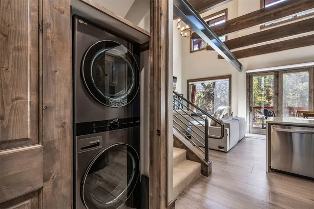 a view of a hallway with washer and dryer