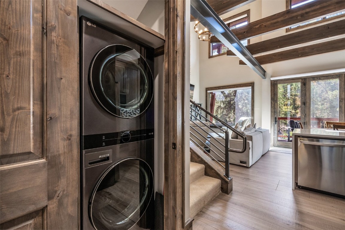 102 Lake Ridge Circle, Unit 1892 Keystone, CO 80435 - Photo 27 of 32 a view of a hallway with washer and dryer