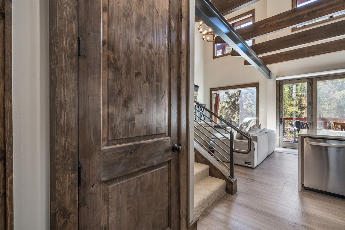 102 Lake Ridge Circle, Unit 1892 Keystone, CO 80435 - Photo 28 of 32 a view of an entryway with wooden floor windows and a livingroom