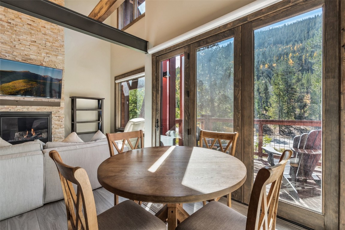 102 Lake Ridge Circle, Unit 1892 Keystone, CO 80435 - Photo 3 of 32 a view of a dining room with furniture window and outside view