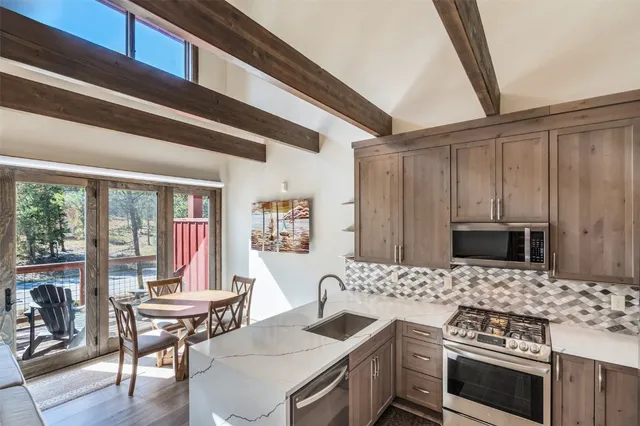a kitchen with a stove and a microwave