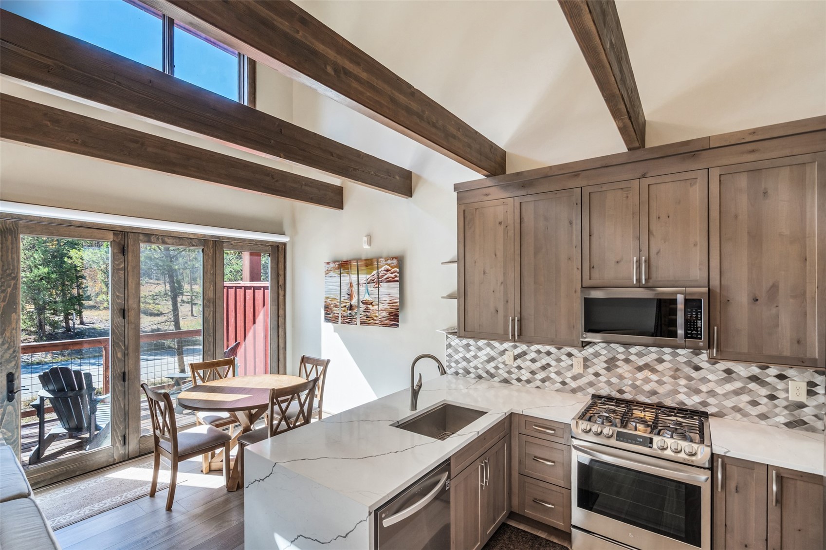 102 Lake Ridge Circle, Unit 1892 Keystone, CO 80435 - Photo 10 of 32 a kitchen with a stove and a microwave