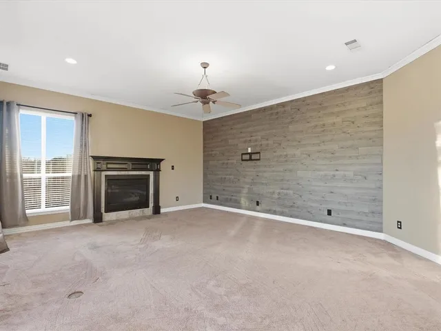 a view of an empty room with a fireplace