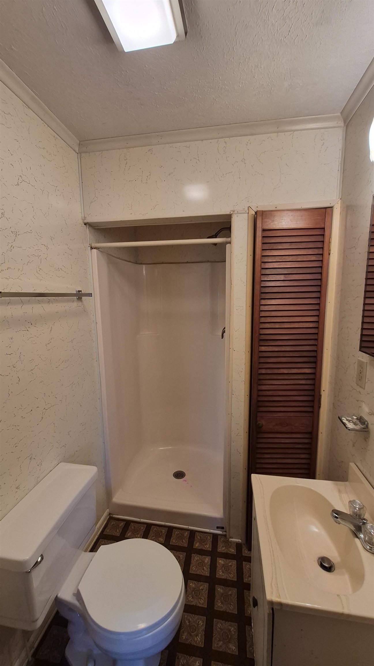 211 Watertank Road Millboro, VA 24460 - Photo 13 of 19 a bathroom with a sink a toilet and shower