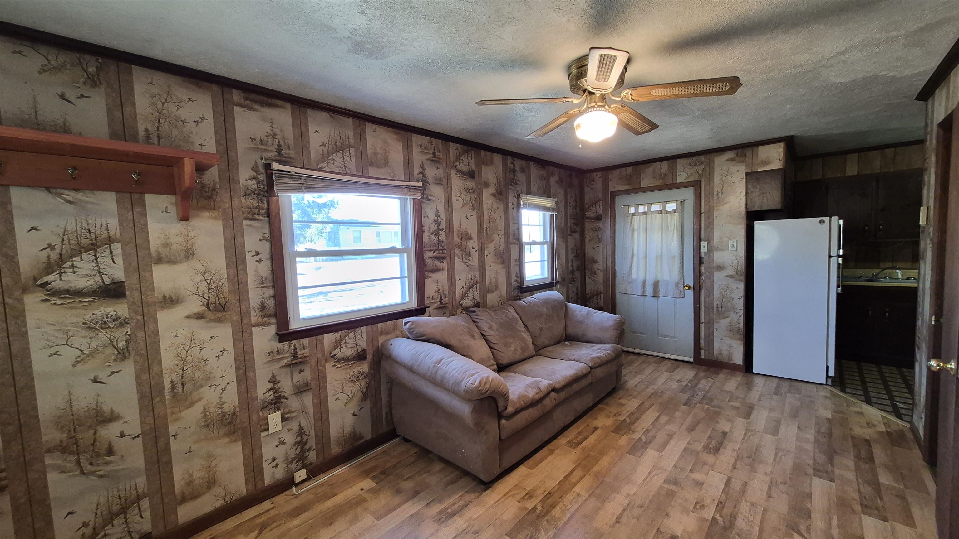 211 Watertank Road Millboro, VA 24460 - Photo 7 of 19 a living room with furniture and a chandelier