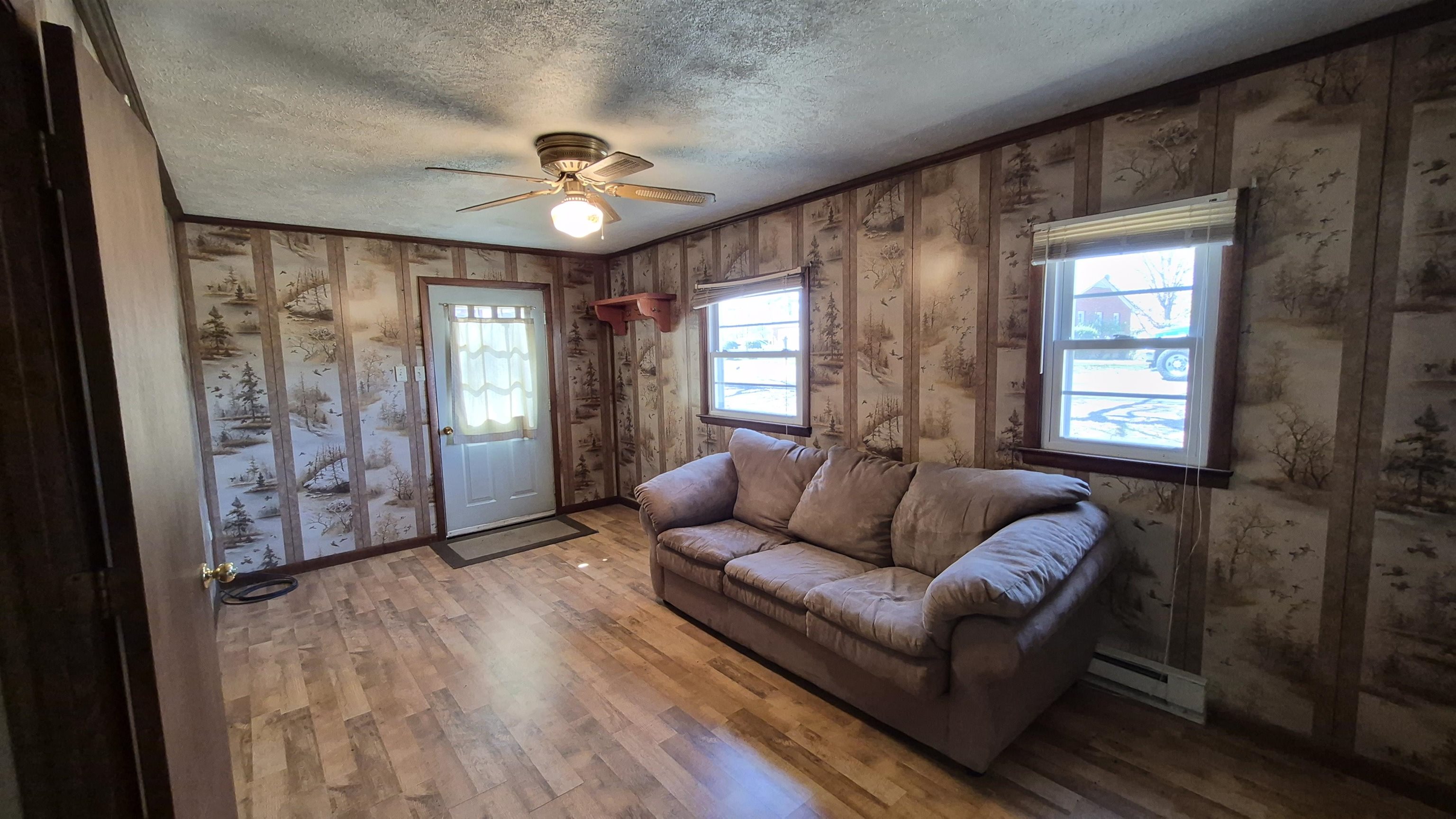 211 Watertank Road Millboro, VA 24460 - Photo 8 of 19 a living room with furniture and a window