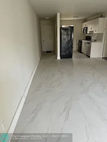 a view of a kitchen with a sink