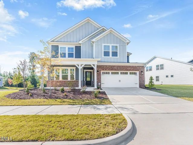 a view of a white house with a swimming pool