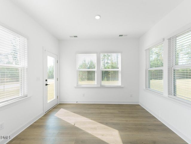 a kitchen with granite countertop a sink cabinets and stainless steel appliances