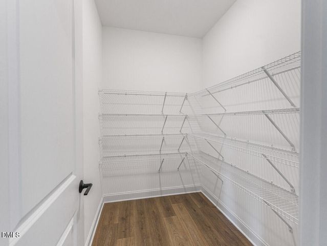 a hallway with wooden floor